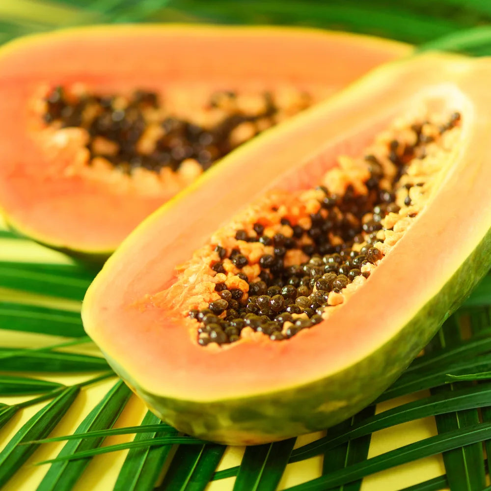 Fresh sliced organic papaya harvested from our nutrient-dense Hawaiian volcanic soil.