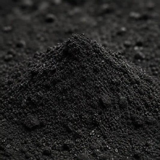 Close-up of a pile of dark soil or compost